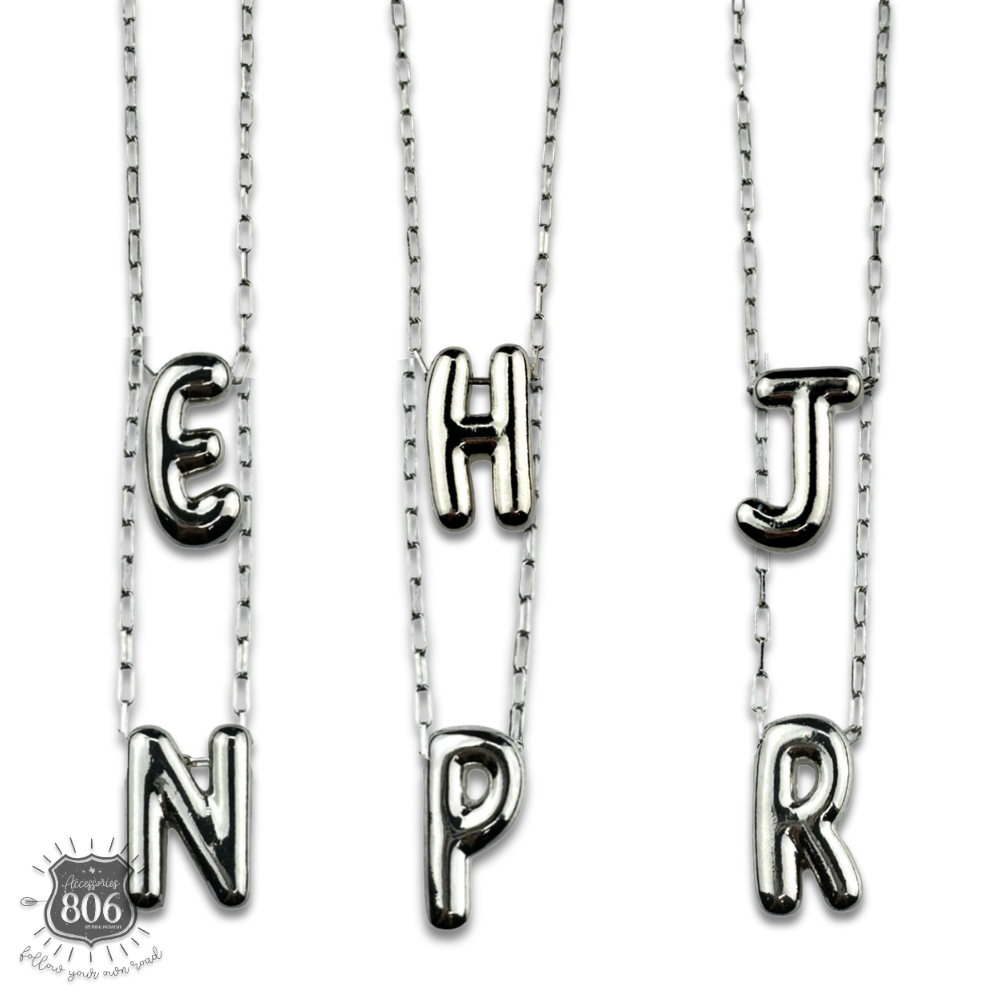 Silver letter pendant on necklace, initial monogram